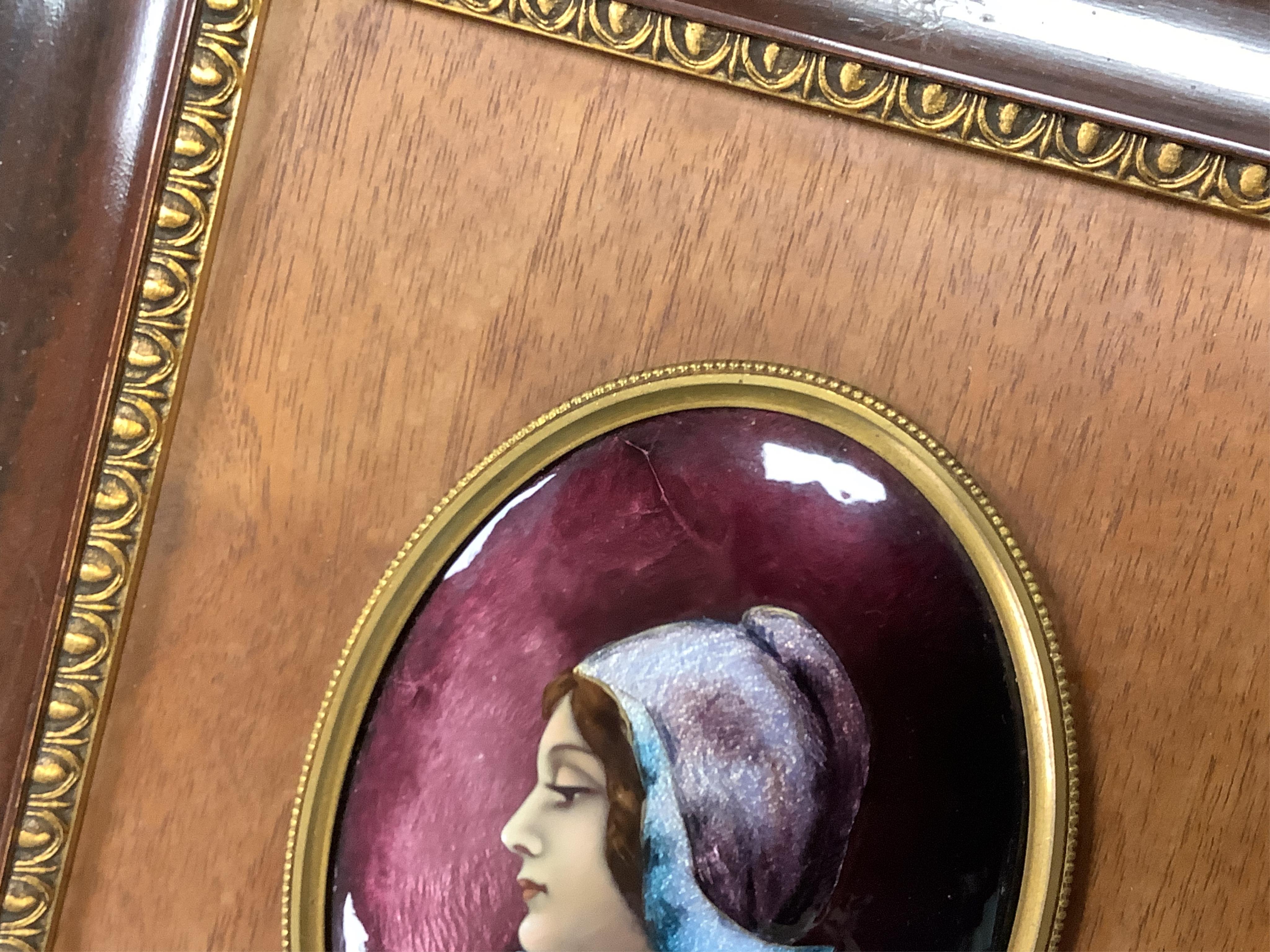 A Limoges framed oval enamel portrait of a lady, signed J Clement, 12cm.